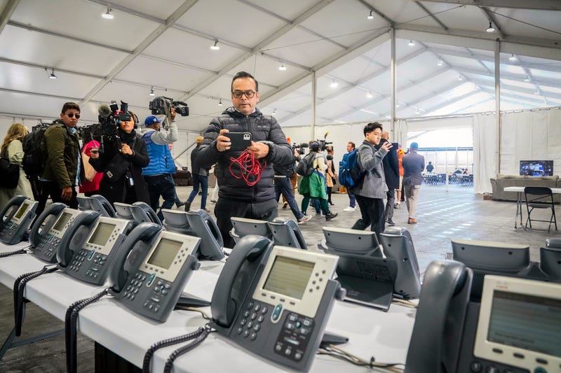 A phone bank center to make international calls, shown during a media tour, is part of New York City's latest temporary shelter on Randall's Island for migrants being bused into the city by southern border states, Oct. 18, 2022