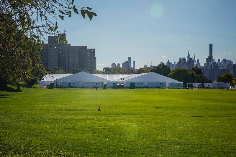 Randall's Island Humanitarian Emergency Response and Relief Center, center, a complex of giant tents, is New York City's latest temporary shelter for an influx of international migrants being bused into the city by southern border states, Oct. 18, 2022