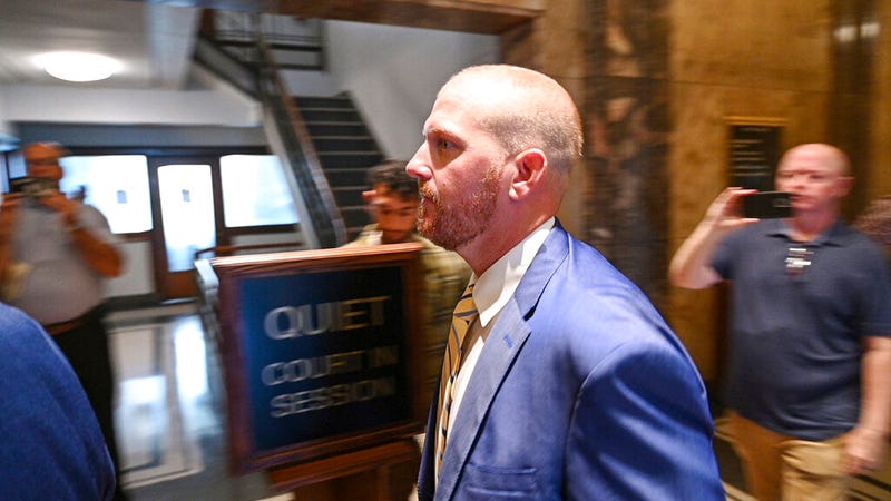Former Kansas City Chiefs assistant coach Britt Reid walks to a courtroom at the Jackson County Courthouse