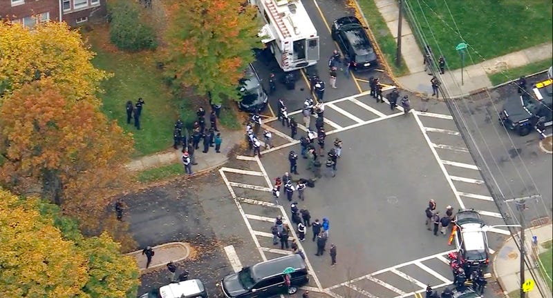In this image provided by WABC-TV, police respond to a report of officers shot Tuesday, Nov. 1, 2022, in Newark, N.J