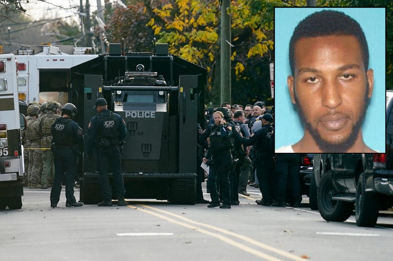 Law enforcement personnel gather at the scene where two officers were reported shot, Tuesday, Nov. 1, 2022, in Newark, N.J