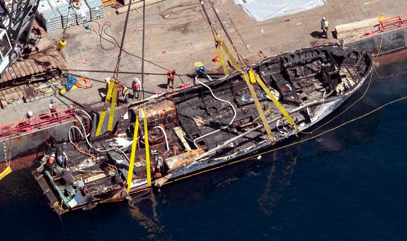 FILE - The burned hull of the dive boat Conception is brought to the surface by a salvage team off Santa Cruz Island, Calif., Sept. 12, 2019. The dive boat captain pleaded not guilty Thursday, Nov. 10, 2022, in federal court for a second time to manslaughter in the fiery deaths of 34 people trapped below deck on his burning vessel three years ago off the Southern California coast.