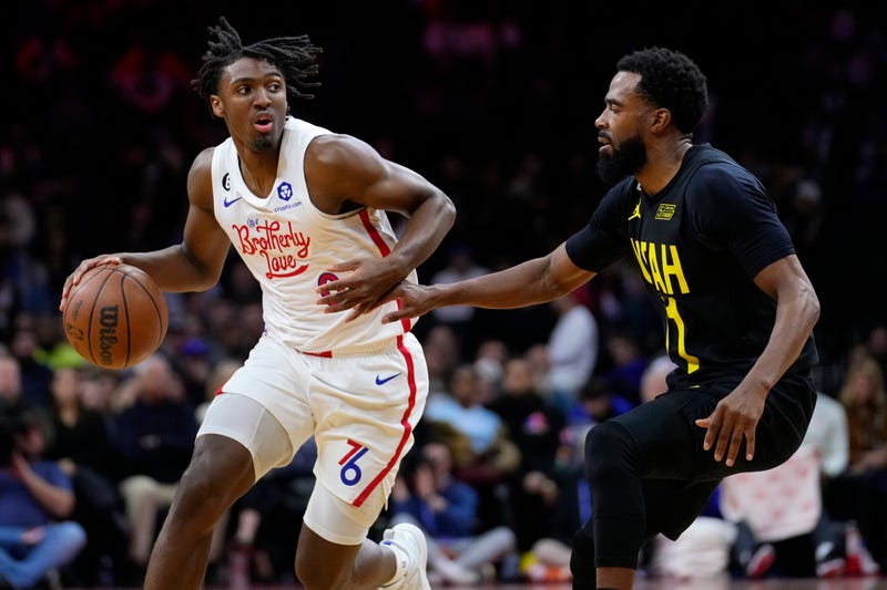 Philadelphia 76ers' Tyrese Maxey, left, tries to get past Utah Jazz's Mike Conley during the first half of an NBA basketball game, Sunday, Nov. 13, 2022, in Philadelphia.