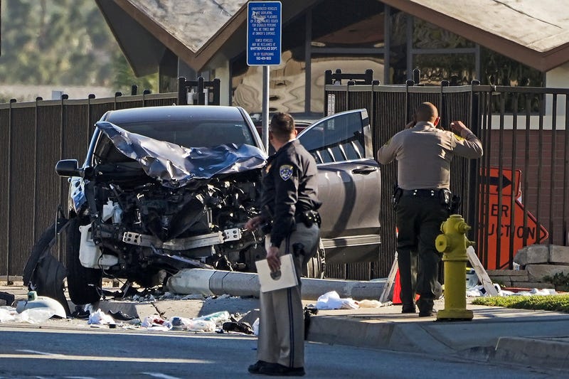 FILE - Two investigators stand next to a mangled SUV that struck Los Angeles County sheriff's recruits in Whittier, Calif., Wednesday, Nov. 16, 2022. One of the Los Angeles County law enforcement recruits struck by the SUV during a training run last week was in deteriorating condition Sunday, Nov. 20. The Los Angeles County Sheriff's Department says in a statement that Alejandro Martinez has suffered setbacks that have left him in grave condition. The department says three other members of the sheriff's academy class remain in critical condition. (