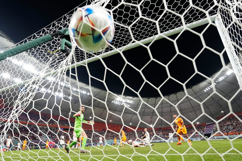 Daley Blind of the Netherlands scores his side's second goal during the World Cup round of 16 soccer match between the Netherlands and the United States, at the Khalifa International Stadium in Doha, Qatar, Saturday, Dec. 3, 2022.