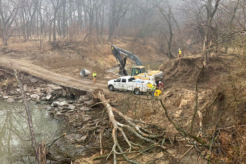 Washington County Road Department constructs an emergency dam to intercept an oil spill after a Keystone pipeline ruptured at Mill Creek in Washington County, Kanas
