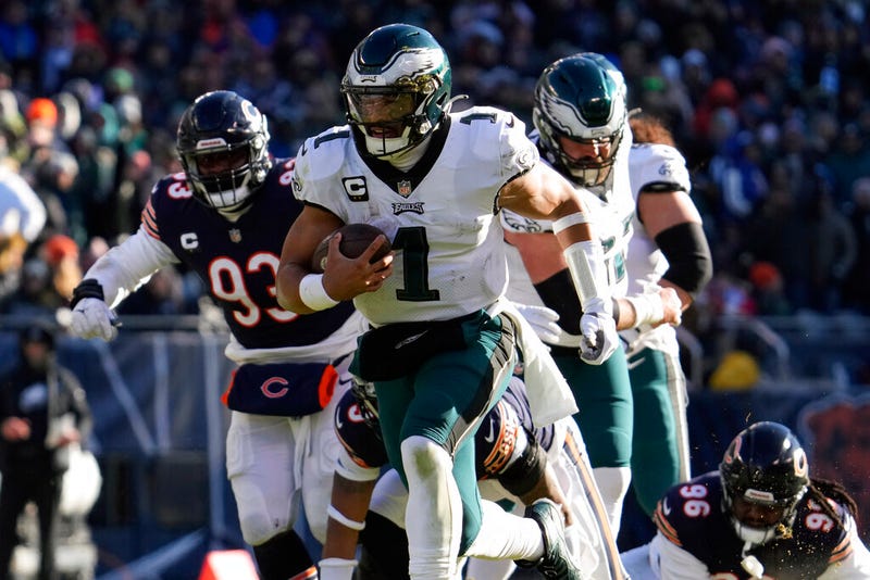 Philadelphia Eagles' Jalen Hurts runs for a touchdown during the first half of an NFL football game against the Chicago Bears, Sunday, Dec. 18, 2022, in Chicago. (AP Photo/Nam Y. Huh)