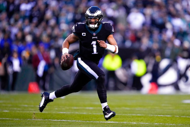 Philadelphia Eagles quarterback Jalen Hurts scrambles against the New York Giants during the first half of an NFL football game, Sunday, Jan. 8, 2023, in Philadelphia. 