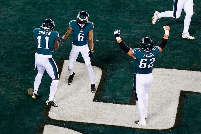 Philadelphia Eagles wide receiver DeVonta Smith (6) celebrates his touchdown catch with wide receiver A.J. Brown (11) and center Jason Kelce (62) during the first half of an NFL divisional round playoff football game against the New York Giants, Jan. 21, 2023, in Philadelphia.