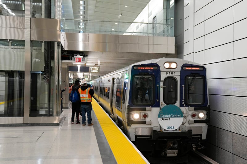 The first Long Island Railroad train to arrive in Grand Central Station slows down as it enters the new annex in New York, Wednesday, Jan. 25, 2023.