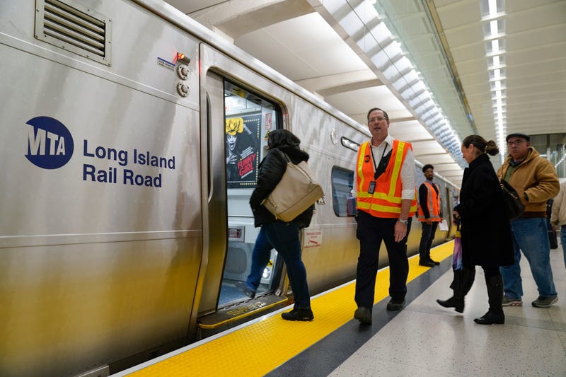 People board a Long Island Railroad train in the new annex to Grand Central Station in New York, Wednesday, Jan. 25, 2023.