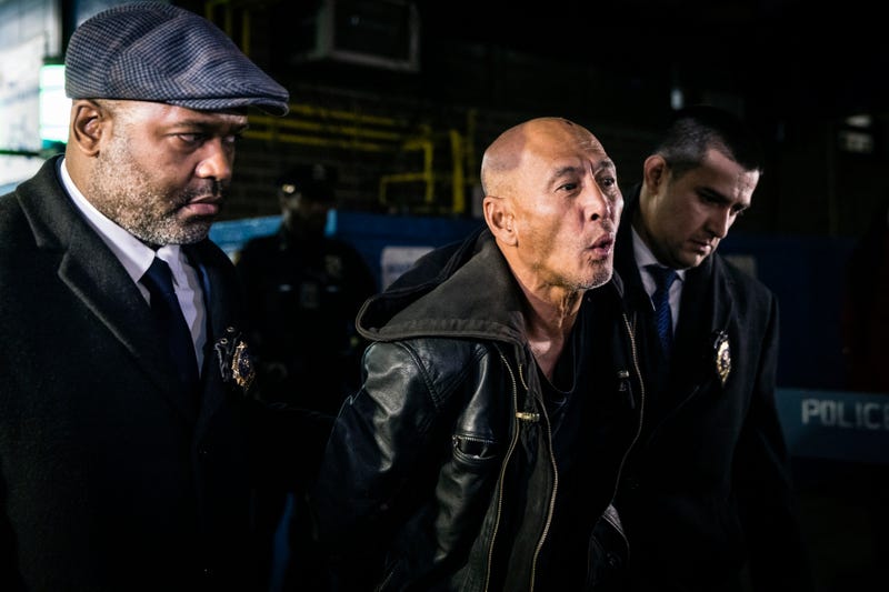 Weng Sor is walked by New York Police Department detectives out of the 68th Precinct in the Brooklyn borough of New York on Tuesday, Feb. 14, 2023