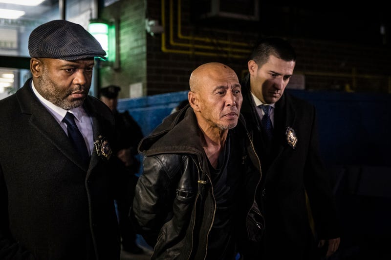 Weng Sor is walked by New York Police Department detectives out of the 68th Precinct in the Brooklyn borough of New York, Tuesday, Feb. 14, 2023. Sor was charged Tuesday with murder and attempted murder after he went on a deadly rampage with a U-Haul truck a day earlier in New York City. (AP Photo/Stefan Jeremiah)