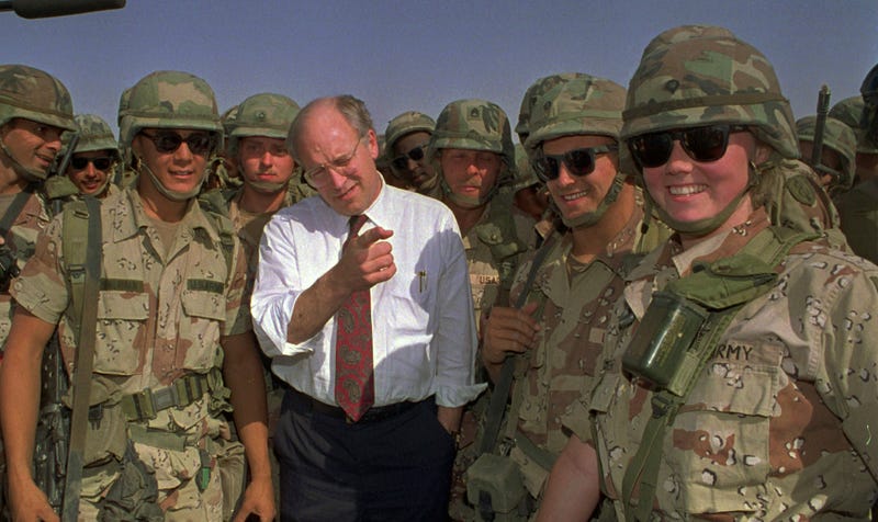 FILE - Defense Secretary Dick Cheney poses with some of the U.S. Army troops stationed in southern Iraq in this May 7, 1991 file photo.