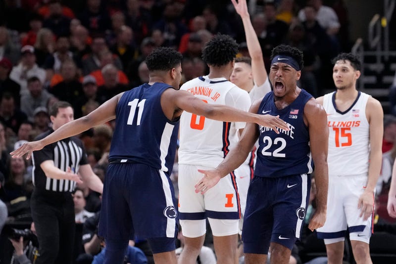 Penn State's Jalen Pickett (22) celebrates with Camren Wynter after scoring and getting fouled during the second half of an NCAA college basketball game against Illinois at the Big Ten men's tournament, Thursday, March 9, 2023, in Chicago