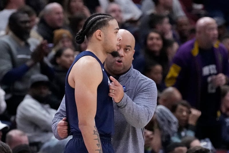 Penn State head coach Micah Shrewsberry talks with Seth Lundy during the second half of an NCAA semifinal basketball game against Indiana at the Big Ten men's tournament, Saturday, March 11, 2023, in Chicago.