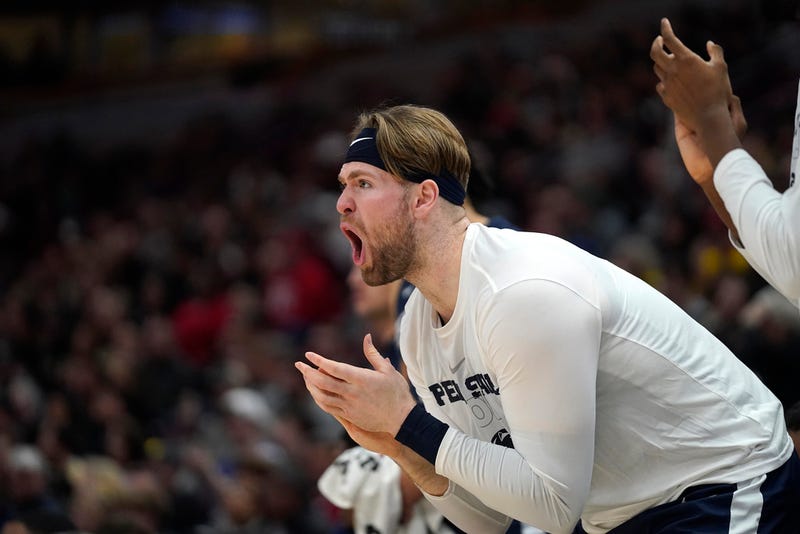  Penn State's Michael Henn cheers on his teammates during the first half of an NCAA college basketball championship game against Purdue at the Big Ten men's tournament