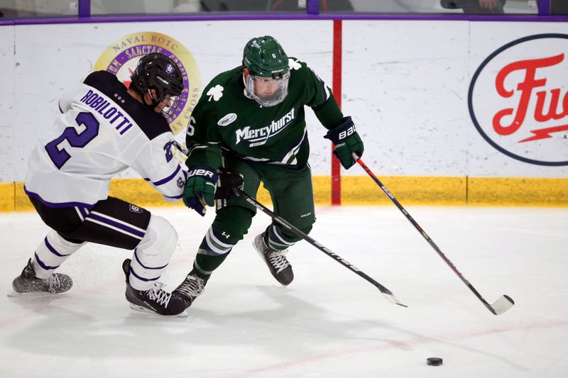 Holy Cross's Jack Robilotti (2) defends Mercyhurst's Carson Briere (6) during the first half of an NCAA hockey game on Friday, Nov. 12, 2021, in Worcester, Mass.