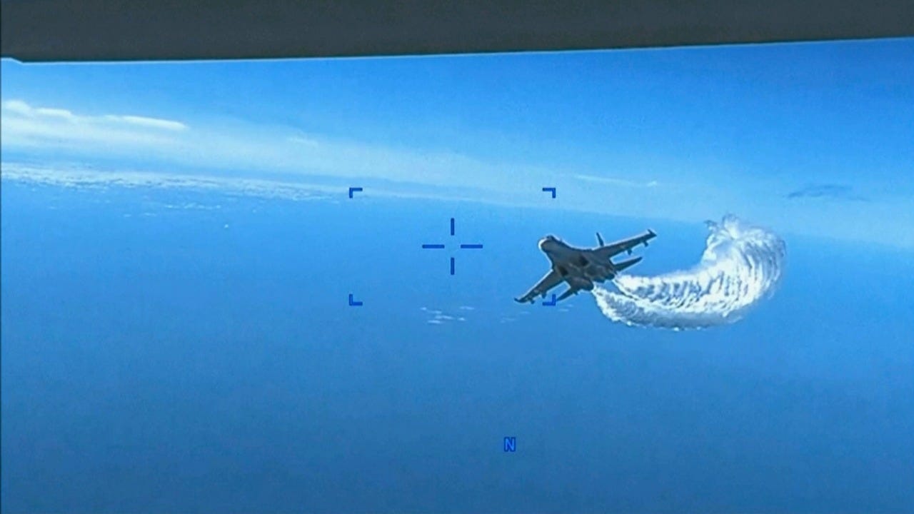 Pentagon video shows Russian jet dumping fuel on US drone