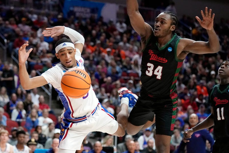  Kansas guard Dajuan Harris Jr. loses the ball out of bounds in front of Howard guard Bryce Harris (34)