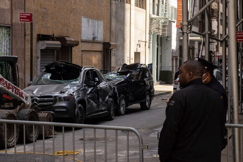 Cars are parked outside a partially collapsed parking garage in the Financial District of New York on April 19, 2023