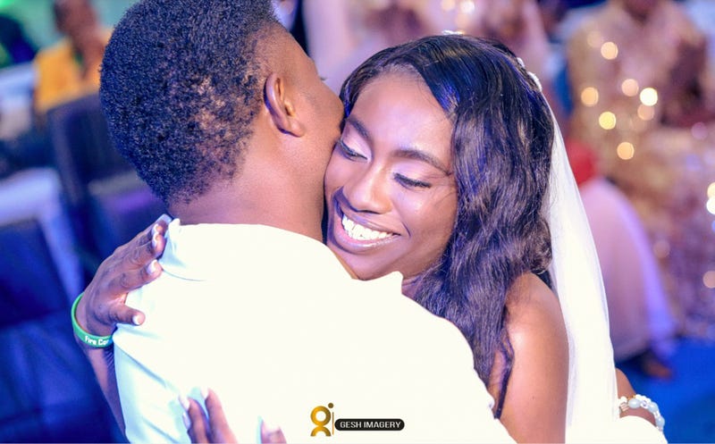 In this photo provided by Gesh Creatives, Eunice Dwumfour celebrates her Nov. 24, 2022 marriage at Champions Royal Assembly in Abuja, Nigeria, with husband and fellow pastor Peter Ezechukwu