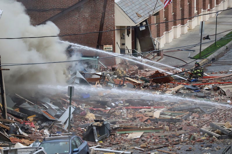 Emergency personnel work at the site of a deadly explosion at a chocolate factory in West Reading, Pa.