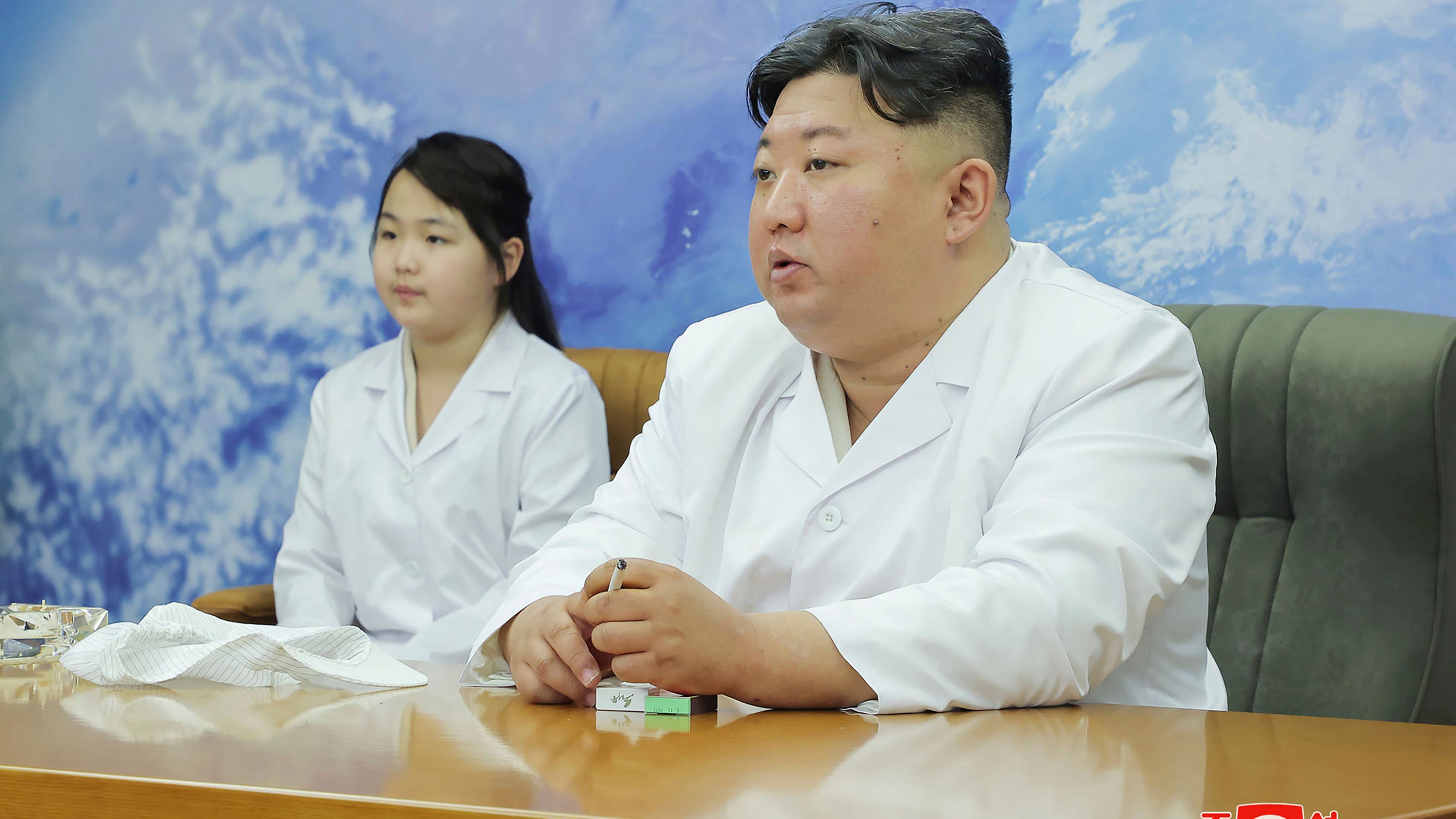 North Korea shows Kim Jong Un examining a military spy satellite that may be launched soon