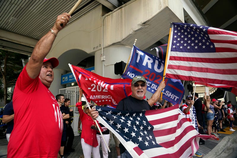 Supporters of former President Donald Trump cheer after he arrived at the Wilkie D. Ferguson Jr. U.S. Courthouse, Tuesday, June 13, 2023, in Miami. Trump appeared in federal court on dozens of felony charges accusing him of illegally hoarding classified documents and thwarting the Justice Department's efforts to get the records back.