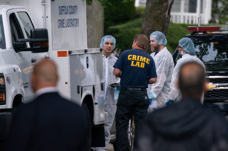 Crime laboratory officers arrive to the house where a suspect has been taken into custody on New York's Long Island in connection with a long-unsolved string of killings, known as the Gilgo Beach murders, Friday, July 14, 2023, in Massapequa Park, N.Y.