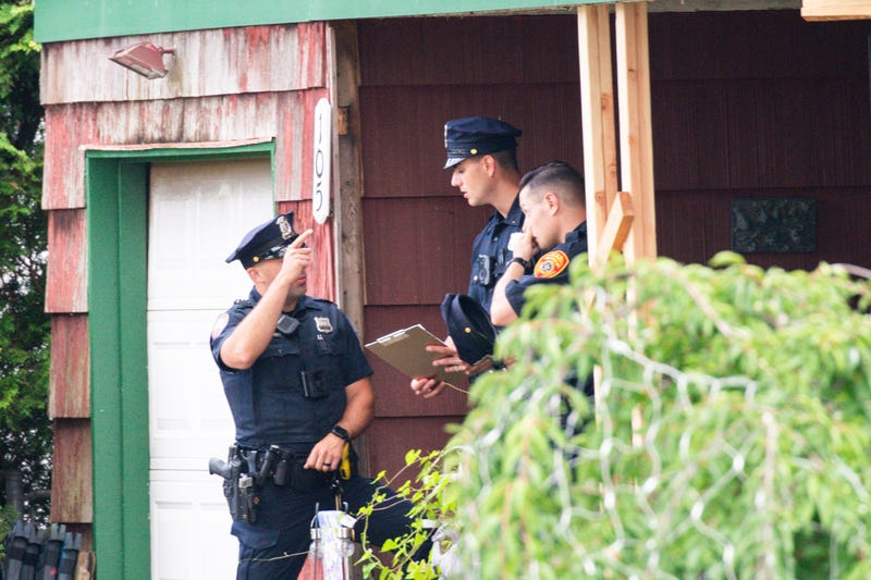Police officers arrive to the house where a suspect has been taken into custody on New York's Long Island in connection with a long-unsolved string of killings, known as the Gilgo Beach murders, Friday, July 14, 2023, in Massapequa Park, N.Y.