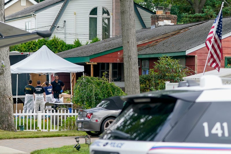 Authorities search the home of suspect Rex Heuermann on July 18, 2023, in Massapequa Park