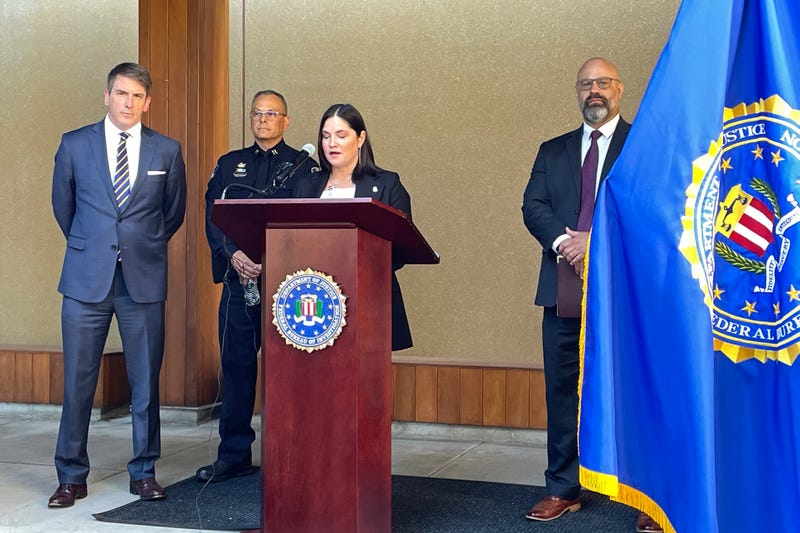 Stephanie Shark, assistant special agent in charge of the FBI Portland field office, speaks at a press conference in Portland, Ore., on Aug. 2, 2023; accompanied by John Casolino (left), senior assistant attorney general of the Criminal Justice Division of the Oregon Department of Justice; Klamath Falls Police Capt. Rob Reynolds (second from left); and Assistant U.S. Attorney Nathan Lichvarcik (right). The press conference was held to discuss the case of an Oregon man facing a federal interstate kidnapping charge after he posed as an undercover police officer to kidnap a woman in Seattle, drove her hundreds of miles to his home in Oregon and locked her in the cinderblock cell until she bloodied her hands breaking the door to escape.