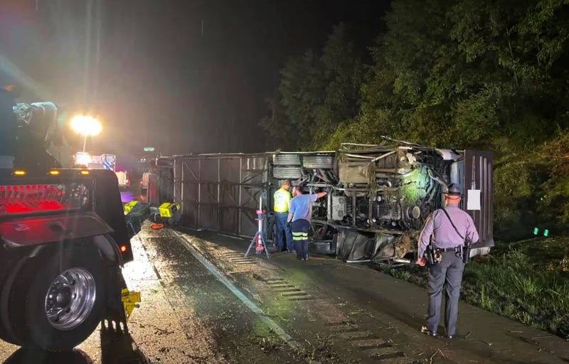 Police and rescue workers arrive on the scene of a bus crash late Sunday, Aug. 6, 2023, in Lower Paxton Township, Dauphin County, Pa. The crash occurred between a passenger vehicle and a charter bus carrying up to 50 passengers, causing multiple fatalities and injuries.