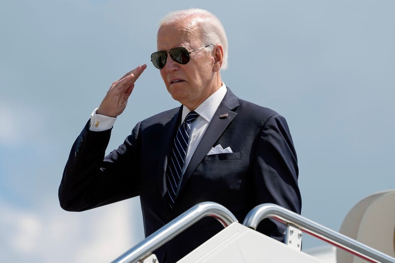 President Joe Biden returns a salute before boarding Air Force One.