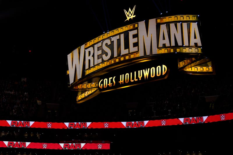 A WrestleMania sign hangs over the crowd during the WWE Monday Night RAW event, Monday, March 6, 2023, in Boston.
