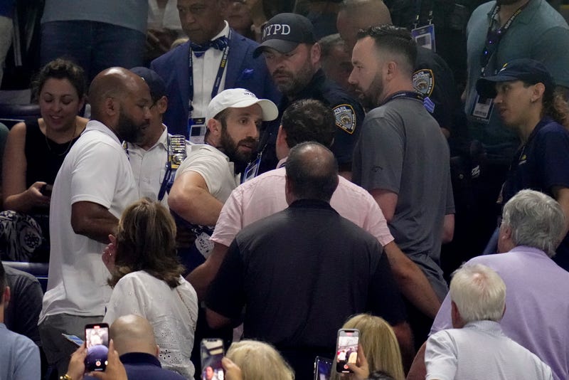 New York police and USTA officials accost protestors in the crowd who disrupted play between Coco Gauff, of the United States, and Karolina Muchova, of the Czech Republic, during the women's singles semifinals of the U.S. Open tennis championships, Thursday, Sept. 7, 2023, in New York