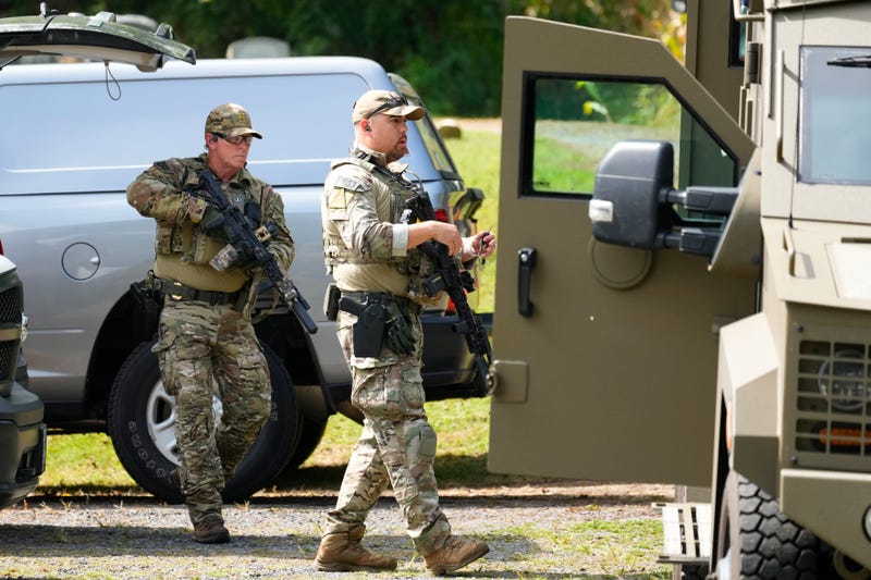 Law enforcement officers gather as they search for escaped convict Danelo Cavalcante in Glenmoore, Pa., Monday, Sept. 11, 2023.