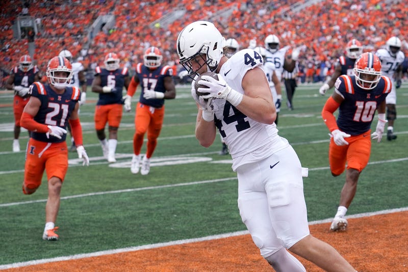 Penn State tight end Tyler Warren catches a touchdown pass from running back Trey Potts during the second half of an NCAA college football game against Illinois Saturday, Sept. 16, 2023, in Champaign, Ill. Penn State won 30-13. (AP Photo/Charles Rex Arbogast)