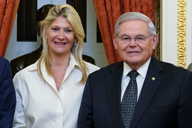 Senate Foreign Relations Committee Chairman, Sen. Bob Menendez, D-N.J., right, and his wife Nadine Arslanian, pose for a photo on Capitol Hill in Washington, Dec. 20, 2022. 