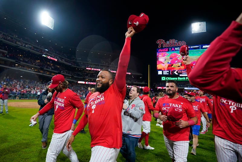 Philadelphia Phillies' Jose Alvarado celebrates after winning a baseball game against the Pittsburgh Pirates to clinch a wild-card playoff spot, Tuesday, Sept. 26, 2023, in Philadelphia. (AP Photo/Matt Slocum)