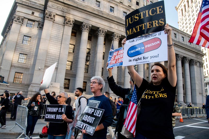 Protesters chant outside New York Supreme Court ahead of Donald Trump's civil business fraud trial on Oct. 2, 2023