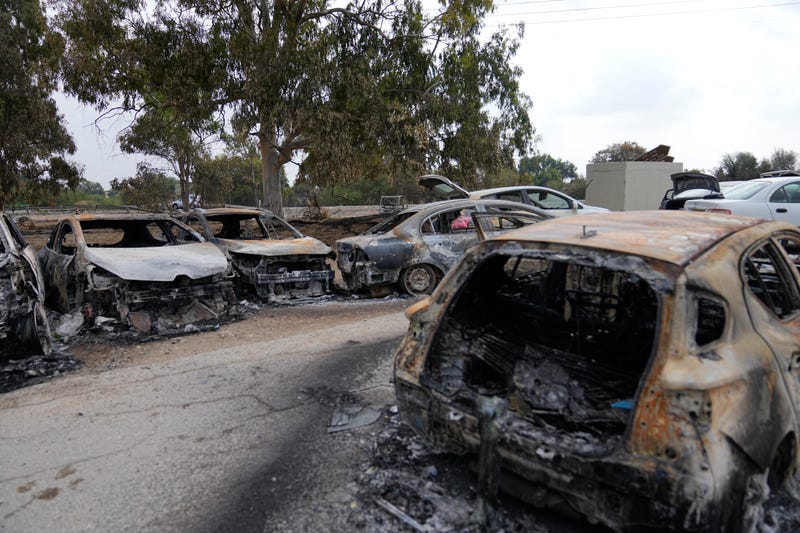 Destroyed cars are seen at the rave party site near the Kibbutz Re'im, close to the Gaza Strip border fence, on Tuesday, Oct.10, 2023. Israel's rescue service Zaka said paramedics had recovered at least 260 bodies of people killed in a surprise attack by Hamas terrorists on Saturday.