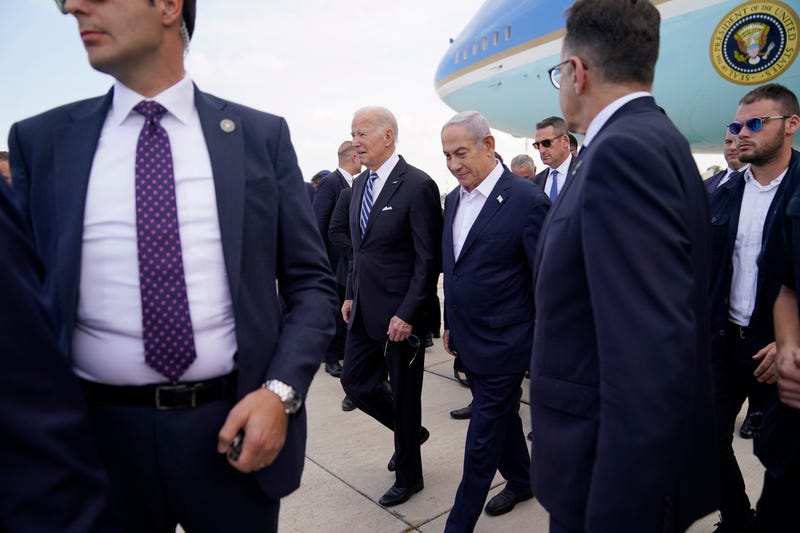 President Joe Biden is greeted by Israeli Prime Minister Benjamin Netanyahu after arriving at Ben Gurion International Airport, Wednesday, Oct. 18, 2023, in Tel Aviv.