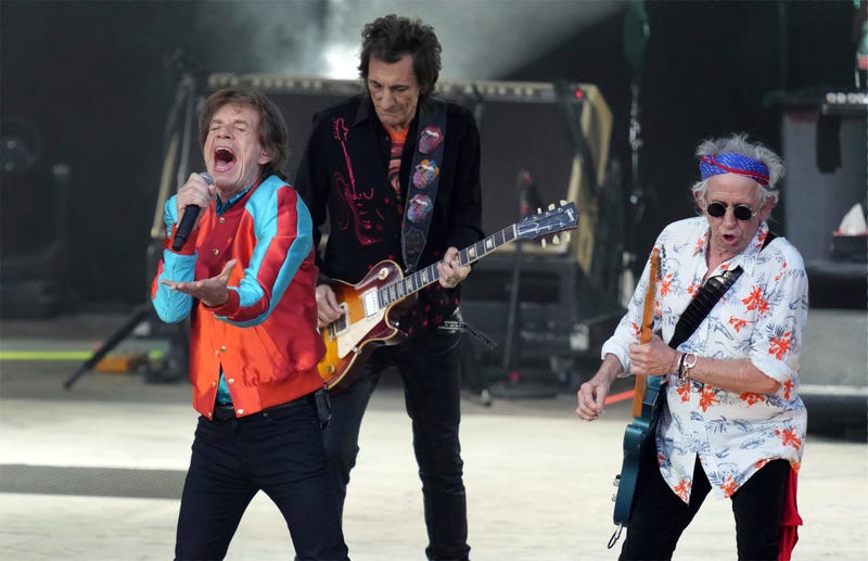 Mick Jagger, left, Ronnie Wood, center, and Keith Richards, right, of the band The Rolling Stones, perform during the last concert of their "Sixty" European tour, Aug. 3, 2022, in Berlin, Germany.