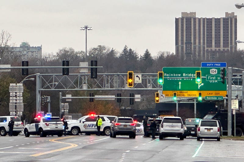 Law enforcement personnel block off the entrance to the Rainbow Bridge border crossing, Wednesday, Nov. 22, 2023, in Niagara Falls, N.Y. The border crossing between the U.S. and Canada has been closed after a vehicle exploded at a checkpoint on a bridge near Niagara Falls. The FBI's field office in Buffalo said in a statement that it was investigating the explosion on the Rainbow Bridge, which connects the two countries across the Niagara River.