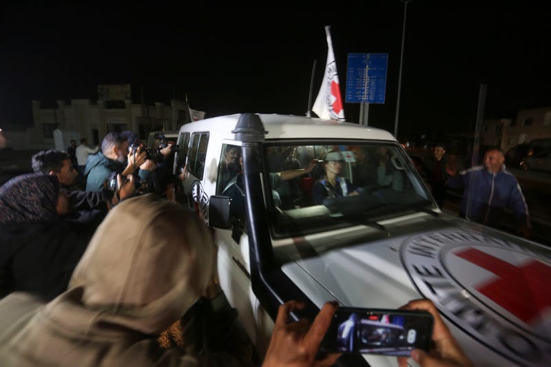 A Red Cross convoy carrying Israeli hostages heads to Egypt from the Gaza Strip at the Rafah border crossing on Sunday, Nov. 26, 2023.