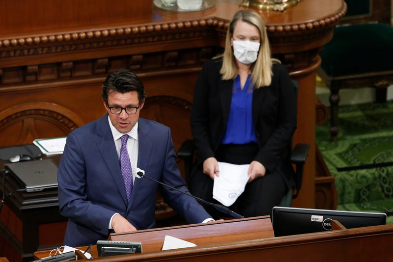 FILE -- Legislative Analyst Gabriel Petek, left, discusses Gov. Gavin Newsom's proposed 2020-21 revised state budget during a hearing the state Capitol in Sacramento, Calif., May 26, 2020. On Thursday, Dec. 7, 2023, Petek said California is facing a $68 billion budget deficit.
