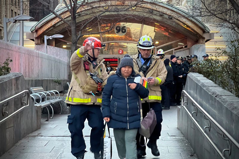 This photo provided by Office New York Mayor shows a person escorted from the 96th St. & Broadway subway station after the derailment of a subway car on Thursday, Jan. 4, 2024