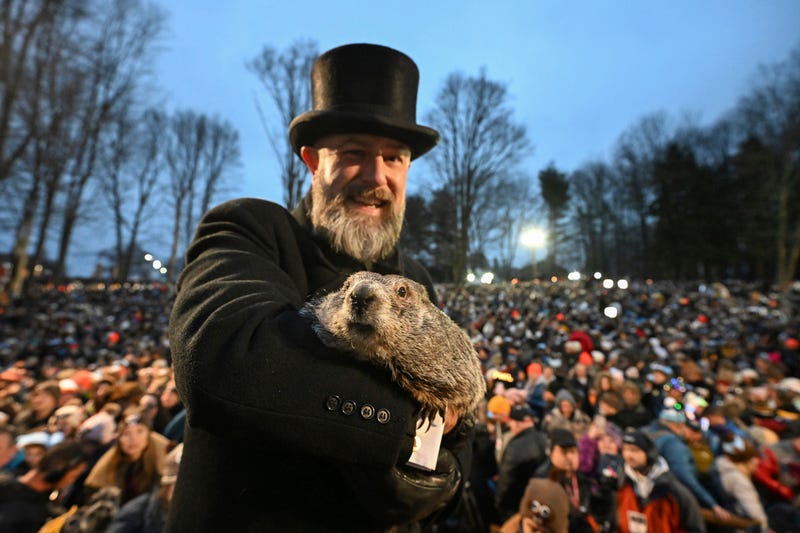 Groundhog Club handler A.J. Dereume holds Punxsutawney Phil, the weather prognosticating groundhog, during the 138th celebration of Groundhog Day on Gobbler's Knob in Punxsutawney, Pa., Friday, Feb. 2, 2024